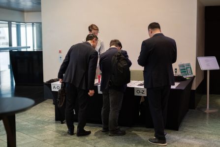 People at the registration desk