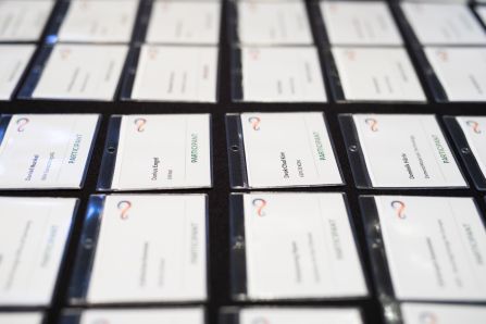 A lot of nametags layed out in straight lines