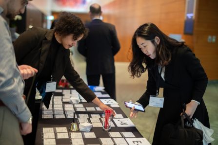 A participant looking at the name tags to see if a colleague has already arrived.