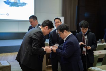 Two businessmen exchanging business cards