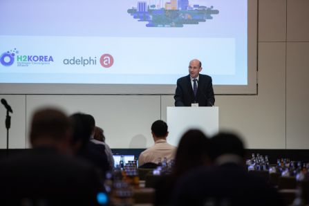 Picture of presenter infront of powerpoint