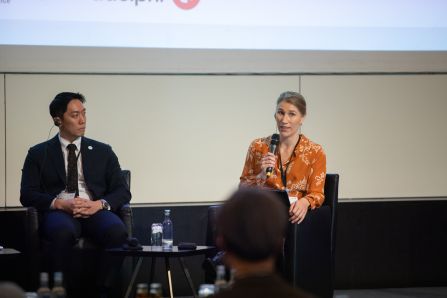 Close up of one speaker and moderator talking