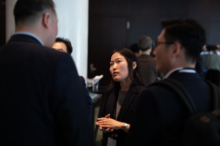 Three people networking infront of the conference hall