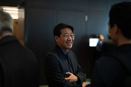 A person laughing to another person
