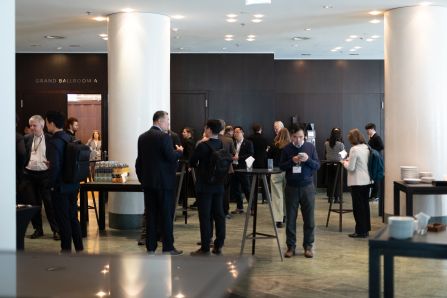 Wide shot of a group chatting over coffee