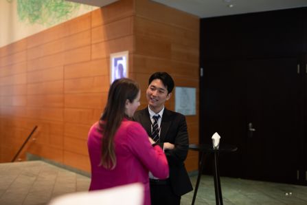 Two people talking and smiling